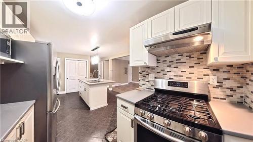Kitchen featuring stainless steel appliances, light countertops, and white cabinets - 61 Bosworth Crescent Unit# Upper, Kitchener, ON - Indoor Photo Showing Kitchen