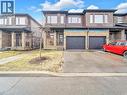 View of front of house featuring an attached garage, brick siding, and driveway - 30 Times Square Boulevard, Hamilton, ON  - Outdoor With Facade 