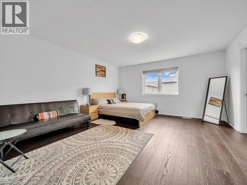 Bedroom with baseboards and light wood-type flooring - 30 Times Square Boulevard, Hamilton, ON - Indoor Photo Showing Bedroom