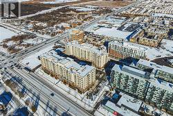 Snowy aerial view featuring a view of city - 