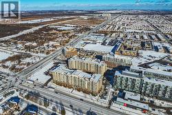 Snowy aerial view featuring a city view - 