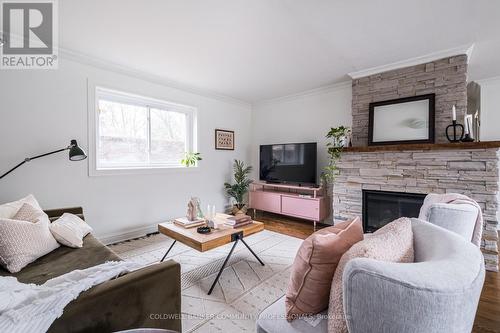 14 Reginald Street, Hamilton, ON - Indoor Photo Showing Living Room With Fireplace