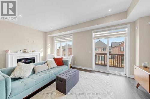 24 Icemaker Way, Whitby, ON - Indoor Photo Showing Living Room With Fireplace