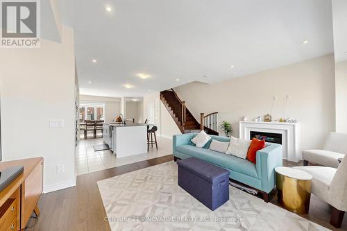 24 Icemaker Way, Whitby, ON - Indoor Photo Showing Living Room With Fireplace