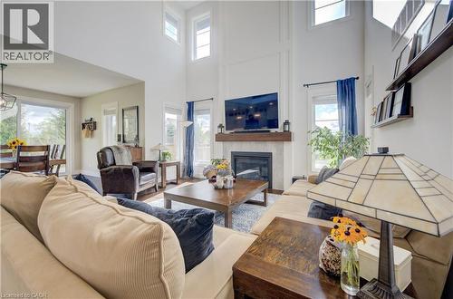 58 Carriage Crossing, Drayton, ON - Indoor Photo Showing Living Room With Fireplace