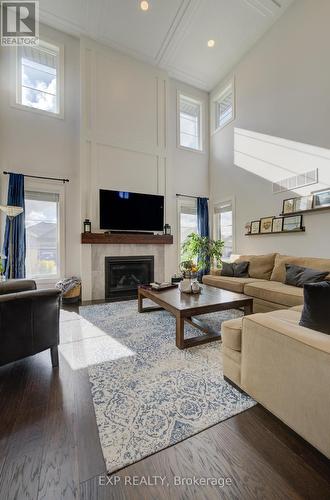 58 Carriage Crossing, Mapleton, ON - Indoor Photo Showing Living Room With Fireplace