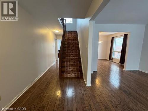 Staircase featuring hardwood / wood-style flooring and baseboards - 536 Thorndale Drive, Waterloo, ON - Indoor Photo Showing Other Room