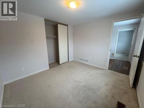 Unfurnished bedroom with light carpet and a closet - 536 Thorndale Drive, Waterloo, ON - Indoor Photo Showing Other Room