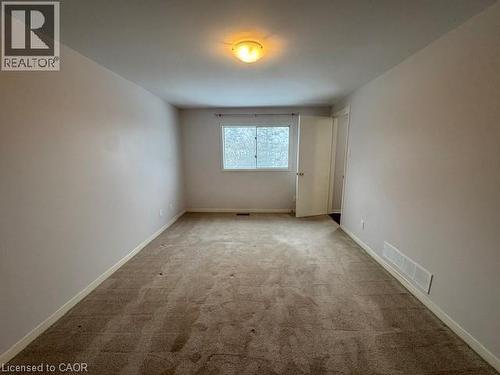 Carpeted spare room featuring baseboards - 536 Thorndale Drive, Waterloo, ON - Indoor Photo Showing Other Room
