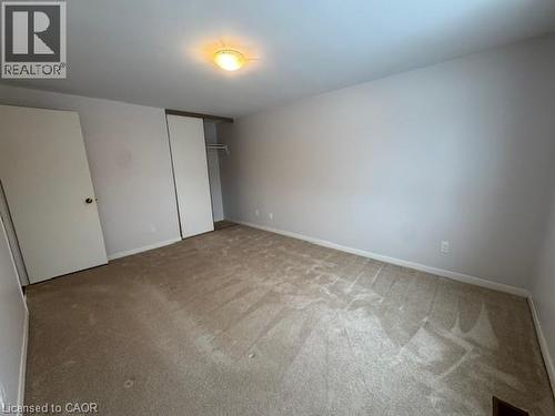 Unfurnished bedroom with a closet and carpet - 536 Thorndale Drive, Waterloo, ON - Indoor Photo Showing Other Room