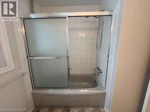 Bathroom featuring bath / shower combo with glass door - 536 Thorndale Drive, Waterloo, ON - Indoor