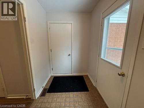 Doorway to outside with baseboards and tile patterned floors - 536 Thorndale Drive, Waterloo, ON - Indoor Photo Showing Other Room