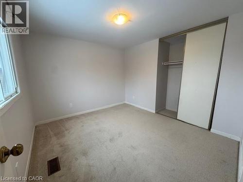 Unfurnished bedroom featuring light carpet and a closet - 536 Thorndale Drive, Waterloo, ON - Indoor Photo Showing Other Room
