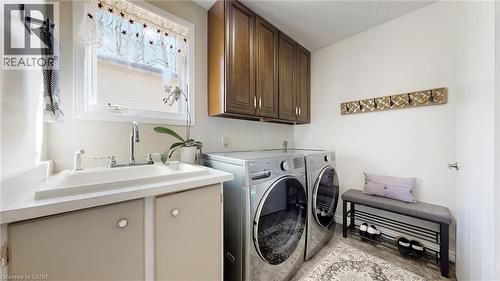 Laundry room with washing machine and clothes dryer and cabinet space - 330 Guelph Avenue, Cambridge, ON - Indoor Photo Showing Laundry Room