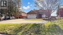 View of front facade featuring a garage and driveway - 330 Guelph Avenue, Cambridge, ON  - Outdoor 