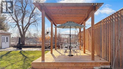 Wooden deck featuring outdoor dining space, a fenced backyard, a pergola, and a patio - 330 Guelph Avenue, Cambridge, ON - Outdoor With Deck Patio Veranda