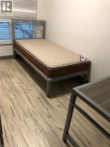 Bedroom featuring light wood finished floors - 258 Sunview Street Unit# 225, Waterloo, ON - Indoor