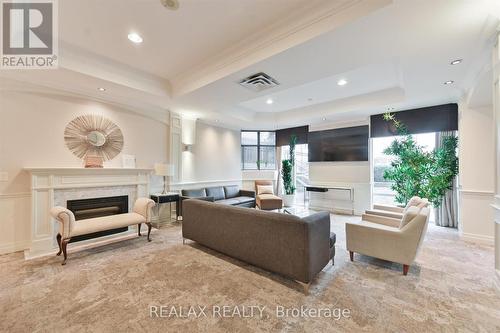 302 - 130 Pond Drive, Markham, ON - Indoor Photo Showing Living Room With Fireplace