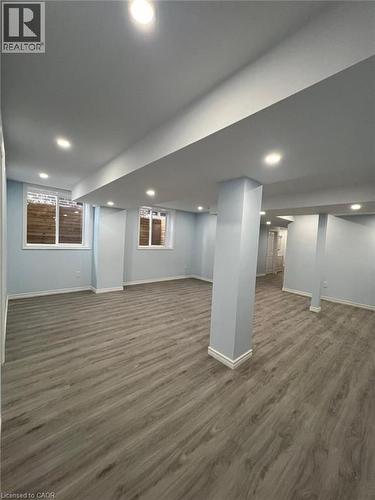 Finished below grade area with dark wood-style flooring and recessed lighting - 167 Histand Trail Unit# Lower, Kitchener, ON - Indoor