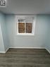 Unfurnished room with baseboards and dark wood-style floors - 167 Histand Trail Unit# Lower, Kitchener, ON  - Indoor Photo Showing Other Room 