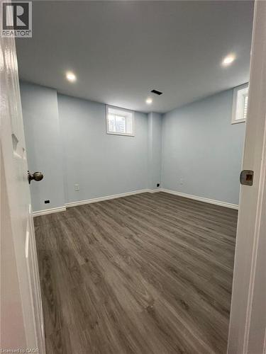 Basement with dark wood-style floors and recessed lighting - 167 Histand Trail Unit# Lower, Kitchener, ON - Indoor