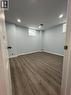 Basement with dark wood-style floors and recessed lighting - 167 Histand Trail Unit# Lower, Kitchener, ON  - Indoor 