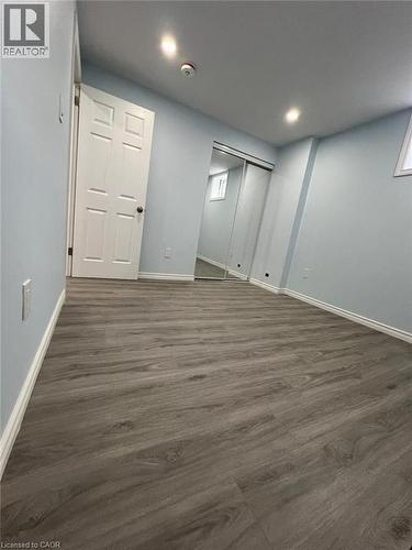 Below grade area with dark wood-style flooring and recessed lighting - 167 Histand Trail Unit# Lower, Kitchener, ON - Indoor