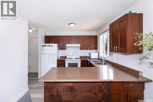 639 Redberry Road, Saskatoon, SK - Indoor Photo Showing Kitchen With Double Sink