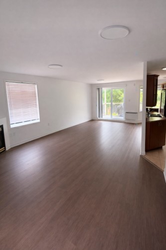 Salon - 2-1561 Rue De Gascogne, Laval (Chomedey), QC - Indoor With Fireplace