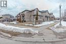 View of front facade featuring a residential view, stone siding, and brick siding - 2 Doon Creek Street, Kitchener, ON  - Outdoor With Facade 