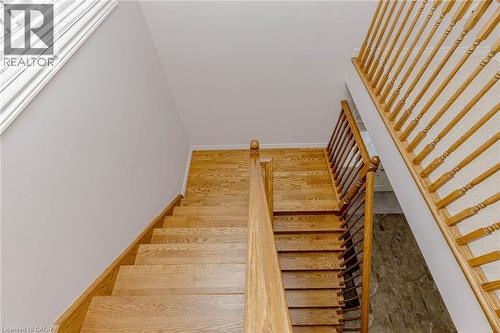 Stairway with wood finished floors - 2 Doon Creek Street, Kitchener, ON - Indoor Photo Showing Other Room