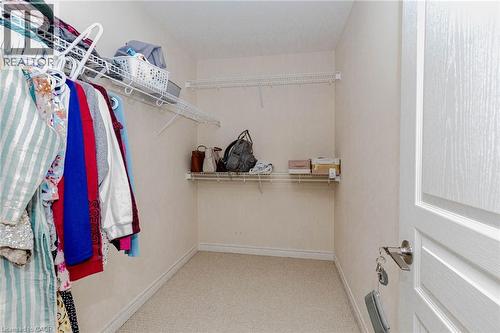 Walk in closet with light carpet - 2 Doon Creek Street, Kitchener, ON - Indoor With Storage