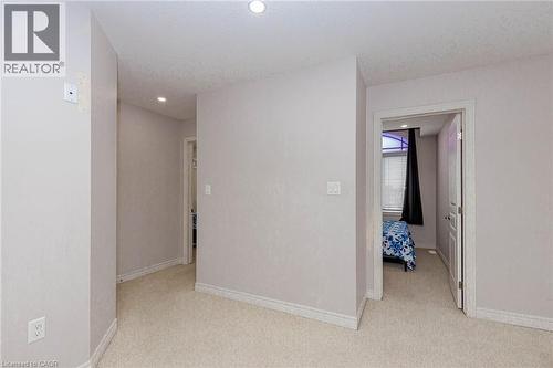 Corridor with light carpet and recessed lighting - 2 Doon Creek Street, Kitchener, ON - Indoor Photo Showing Other Room