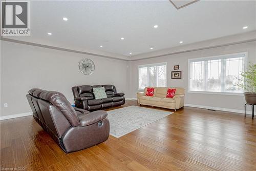 Living room with hardwood / wood-style flooring and recessed lighting - 2 Doon Creek Street, Kitchener, ON - Indoor Photo Showing Living Room