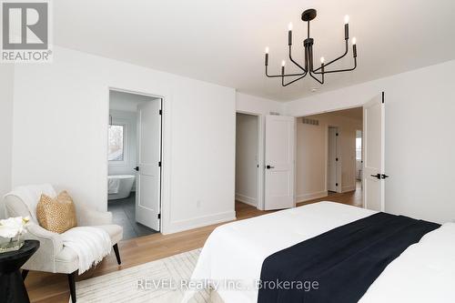 Primary bedroom with double doors - 1129 Dipietro Street, Fort Erie (Lakeshore), ON - Indoor Photo Showing Bedroom