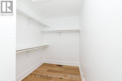 Large walk in closet in primary bedroom - 1129 Dipietro Street, Fort Erie (Lakeshore), ON - Indoor With Storage