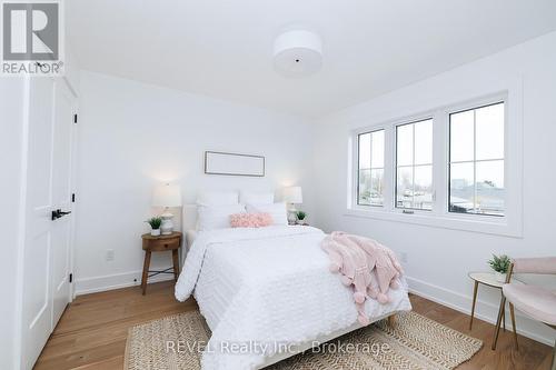 Bedroom with large windows - 1129 Dipietro Street, Fort Erie (Lakeshore), ON - Indoor Photo Showing Bedroom