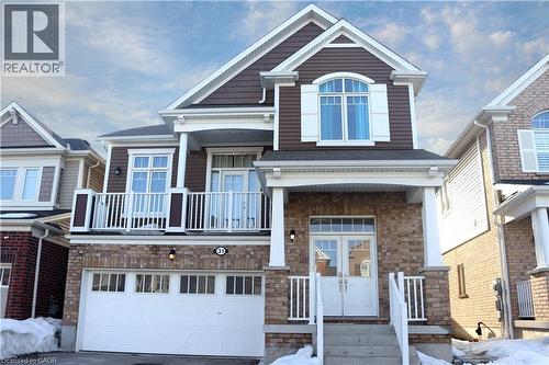 Craftsman inspired home with french doors, an attached garage, driveway, a balcony, and brick siding - 31 Sofitel Drive, Kitchener, ON - Outdoor With Balcony With Facade