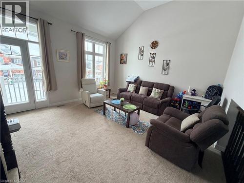 Carpeted living area with lofted ceiling and baseboards - 31 Sofitel Drive, Kitchener, ON - Indoor Photo Showing Living Room