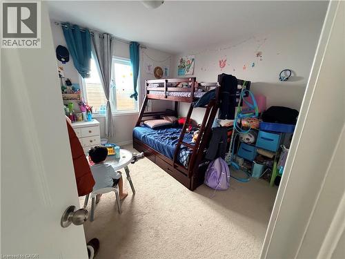Bedroom with light colored carpet and baseboards - 31 Sofitel Drive, Kitchener, ON - Indoor Photo Showing Bedroom