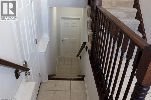 Stairway featuring tile patterned flooring and baseboards - 31 Sofitel Drive, Kitchener, ON - Indoor Photo Showing Other Room