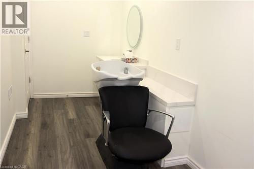 Half bathroom featuring dark wood-style floors and vanity - 31 Sofitel Drive, Kitchener, ON - Indoor