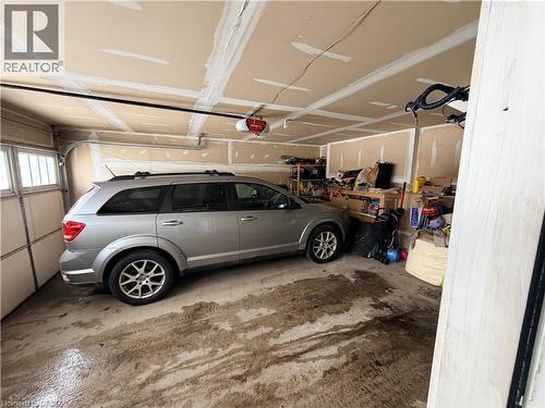 Garage featuring a garage door opener - 31 Sofitel Drive, Kitchener, ON - Indoor Photo Showing Garage