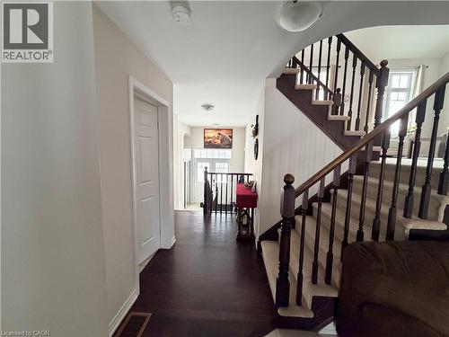 Stairway with wood finished floors and arched walkways - 31 Sofitel Drive, Kitchener, ON - Indoor Photo Showing Other Room