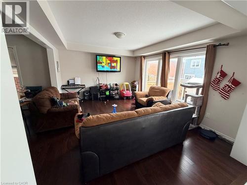Living area with hardwood / wood-style flooring and a textured ceiling - 31 Sofitel Drive, Kitchener, ON - Indoor Photo Showing Other Room