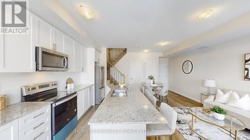 416 - 1577 Rose Way, Milton, ON - Indoor Photo Showing Kitchen With Upgraded Kitchen