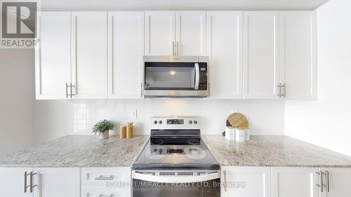 416 - 1577 Rose Way, Milton, ON - Indoor Photo Showing Kitchen With Upgraded Kitchen