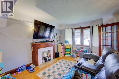34 Barons Avenue S, Hamilton, ON - Indoor Photo Showing Living Room With Fireplace