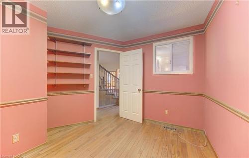 Empty room with a textured ceiling and light wood-style floors - 190 Silvercrest Drive, Waterloo, ON - Indoor Photo Showing Other Room