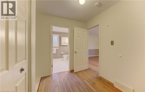 Hall with a textured ceiling and light wood finished floors - 190 Silvercrest Drive, Waterloo, ON - Indoor Photo Showing Other Room